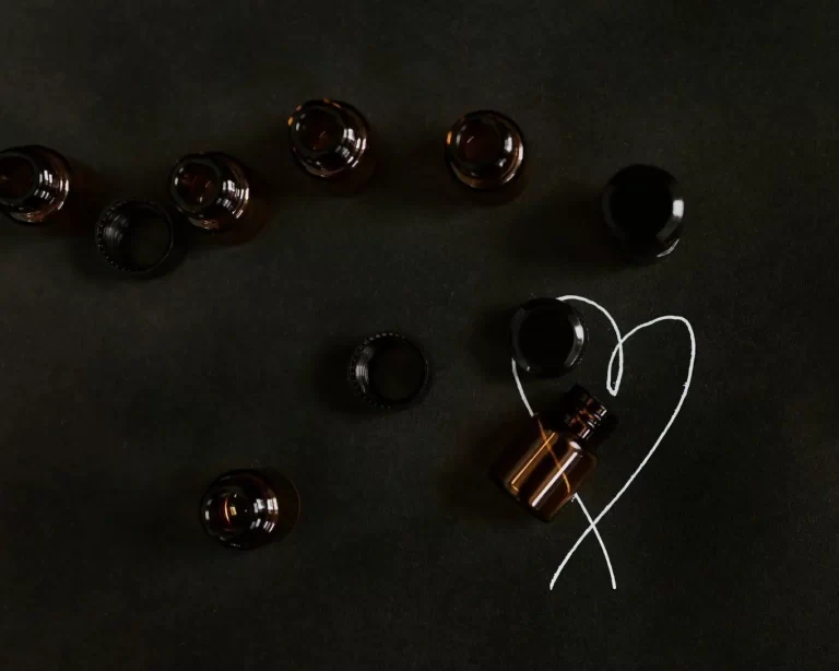 Tincture bottles with a heart drawn next to them